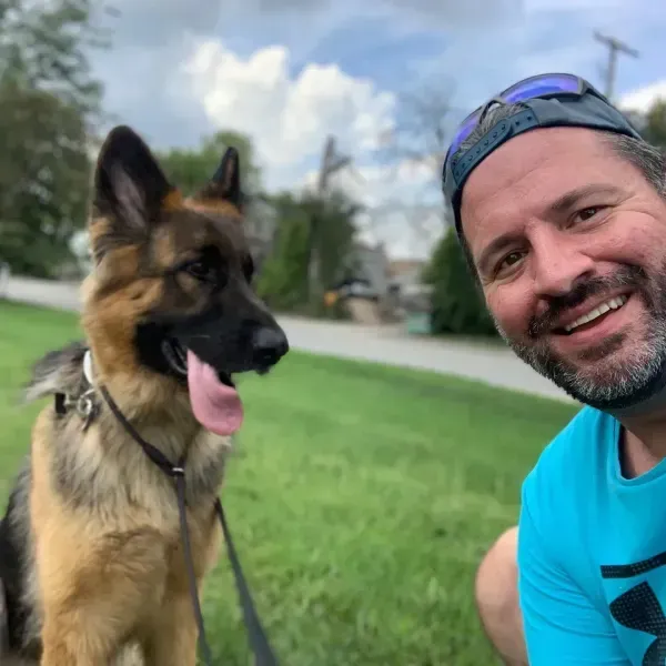 Man with german Shepherd dog