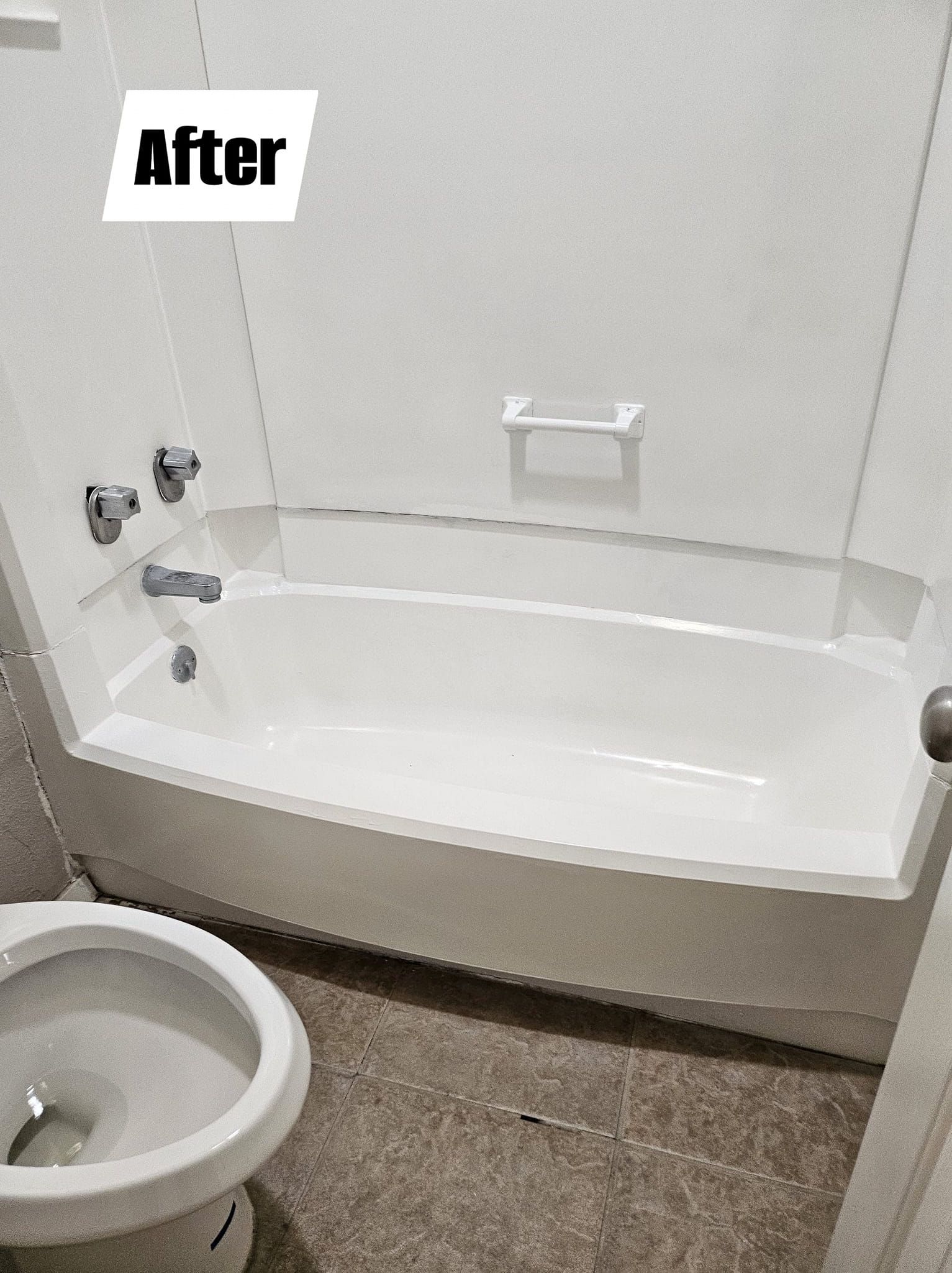 A bathroom with a bathtub , toilet and shower.