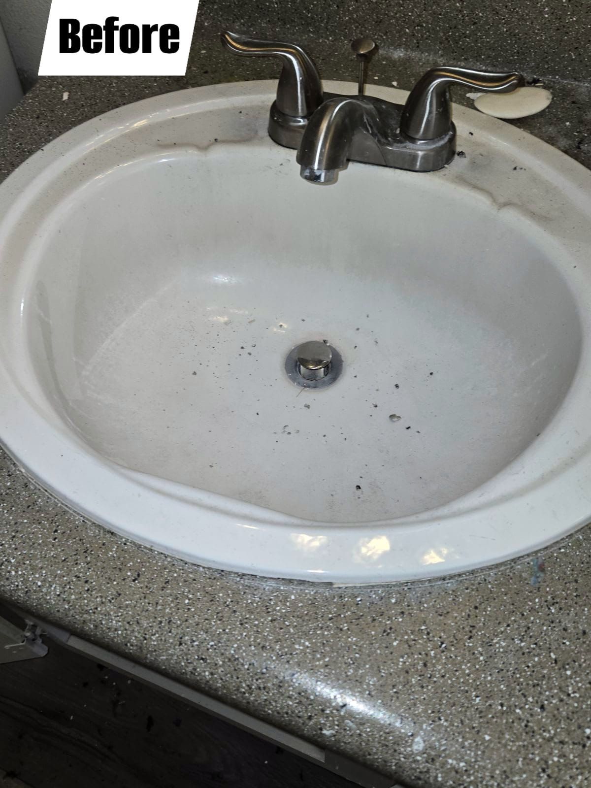 A bathroom sink is shown before being cleaned