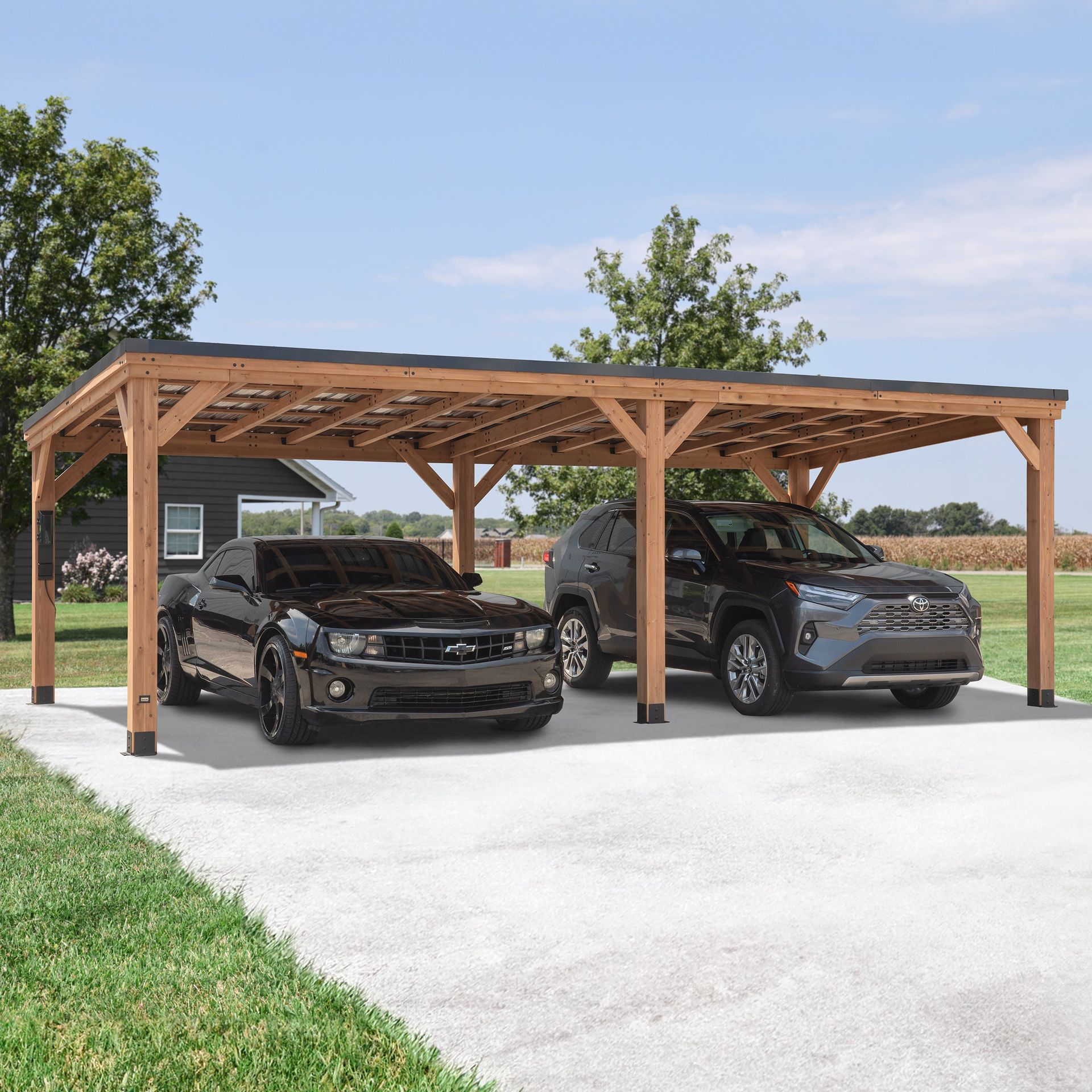 Two cars parked under a wooden carport on a concrete driveway in front of a house.