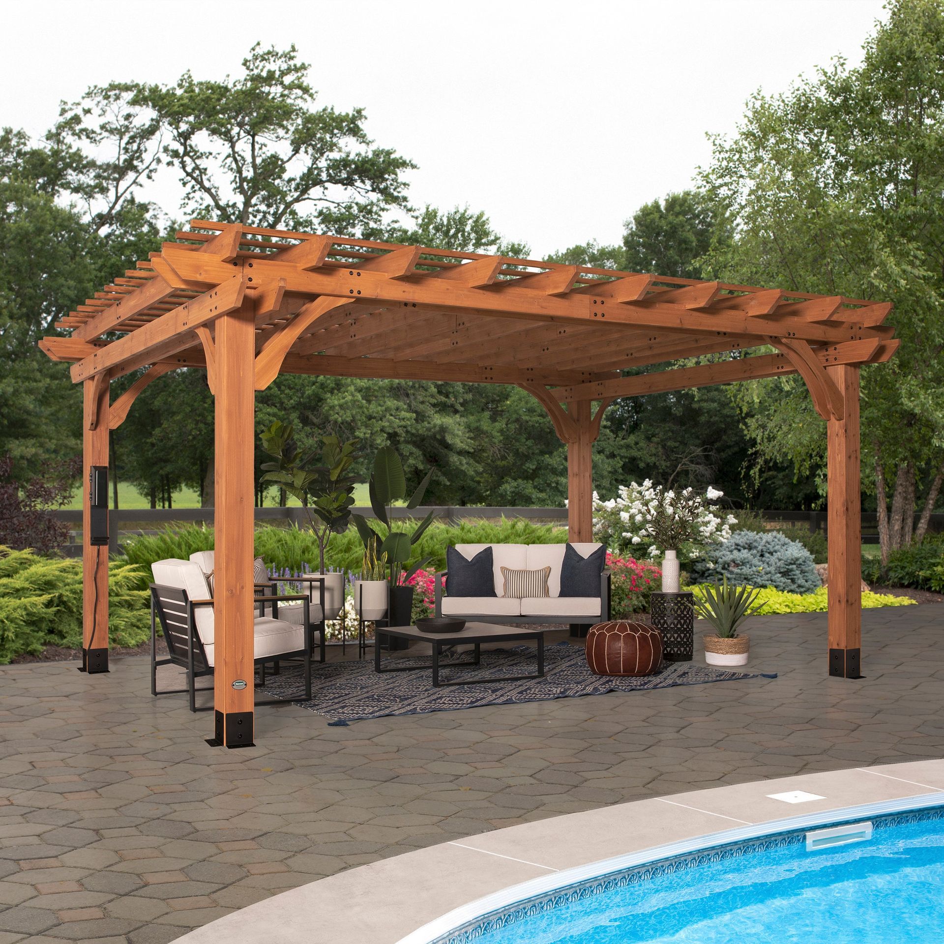 Wooden pergola with patio furniture by a pool.