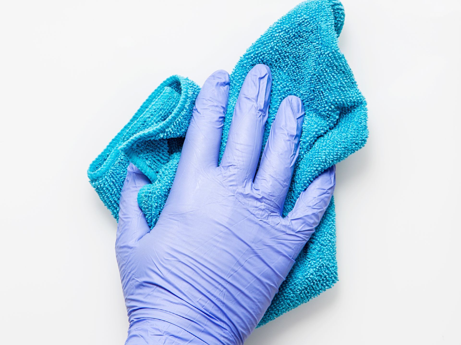 gloved hand wiping surface