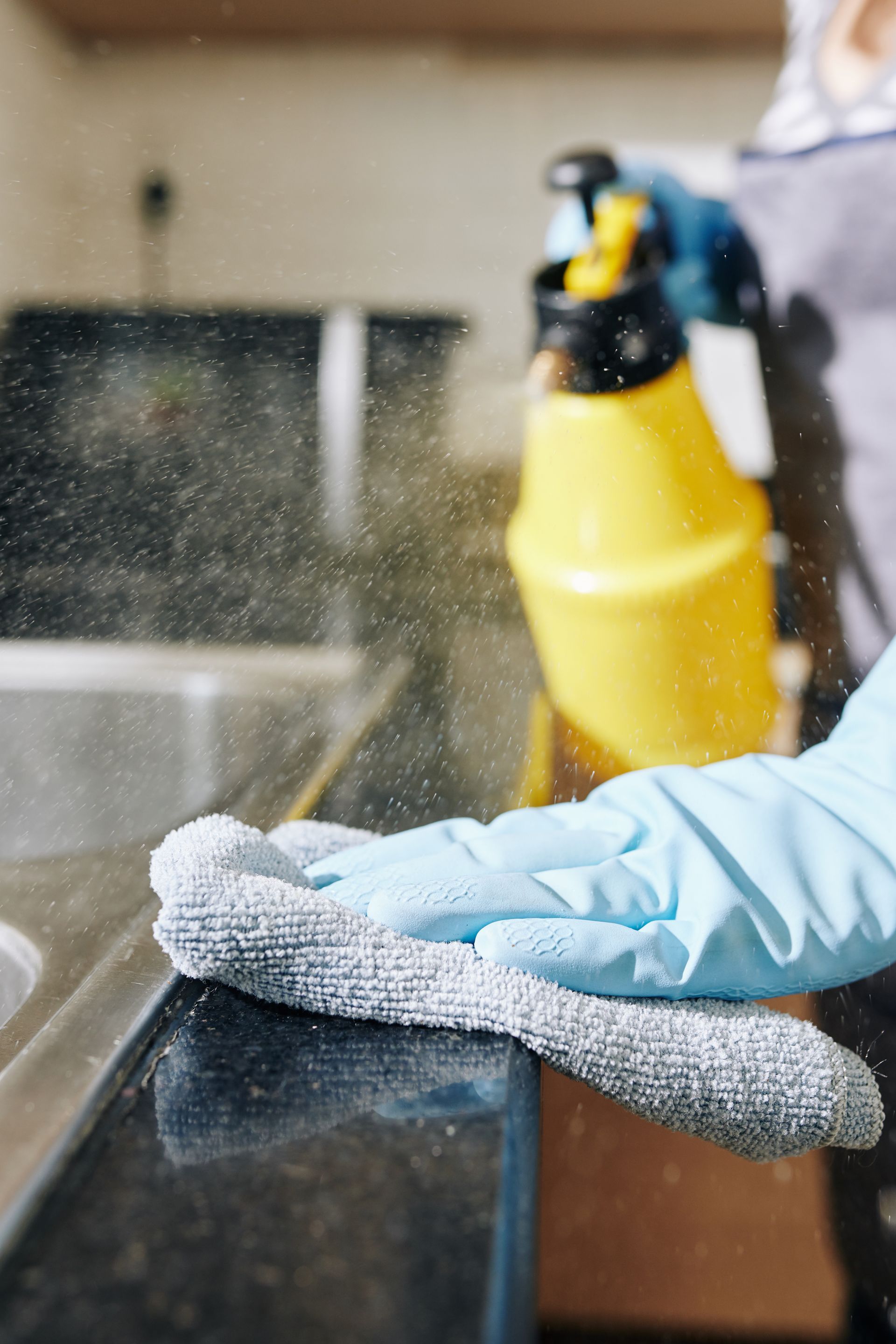 person cleaning surface