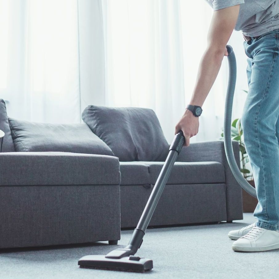 man vacuuming