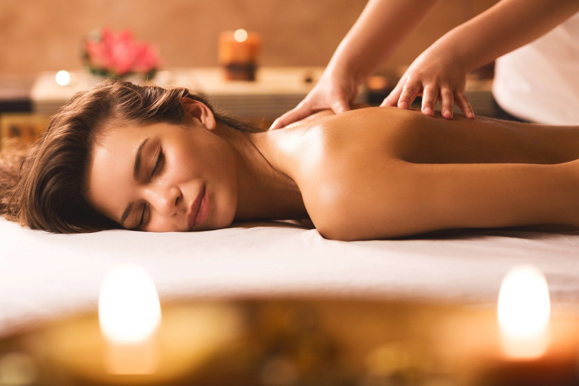 women receiving back massage