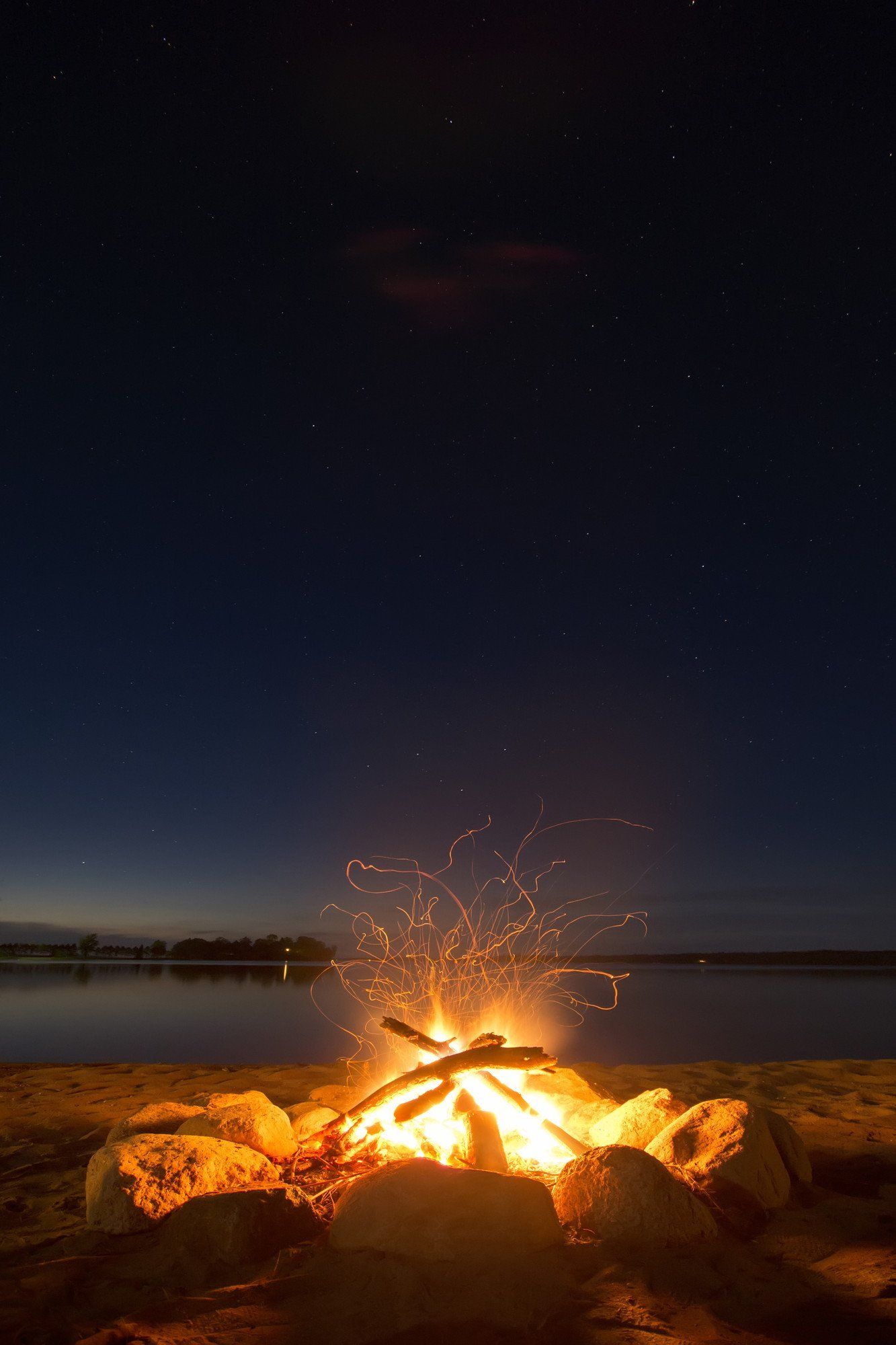 picture of a camp fire on a beach