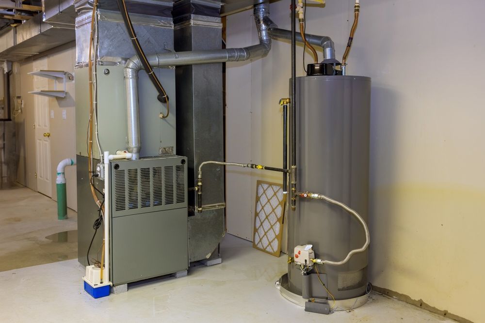 There is a water heater and a furnace in the basement.