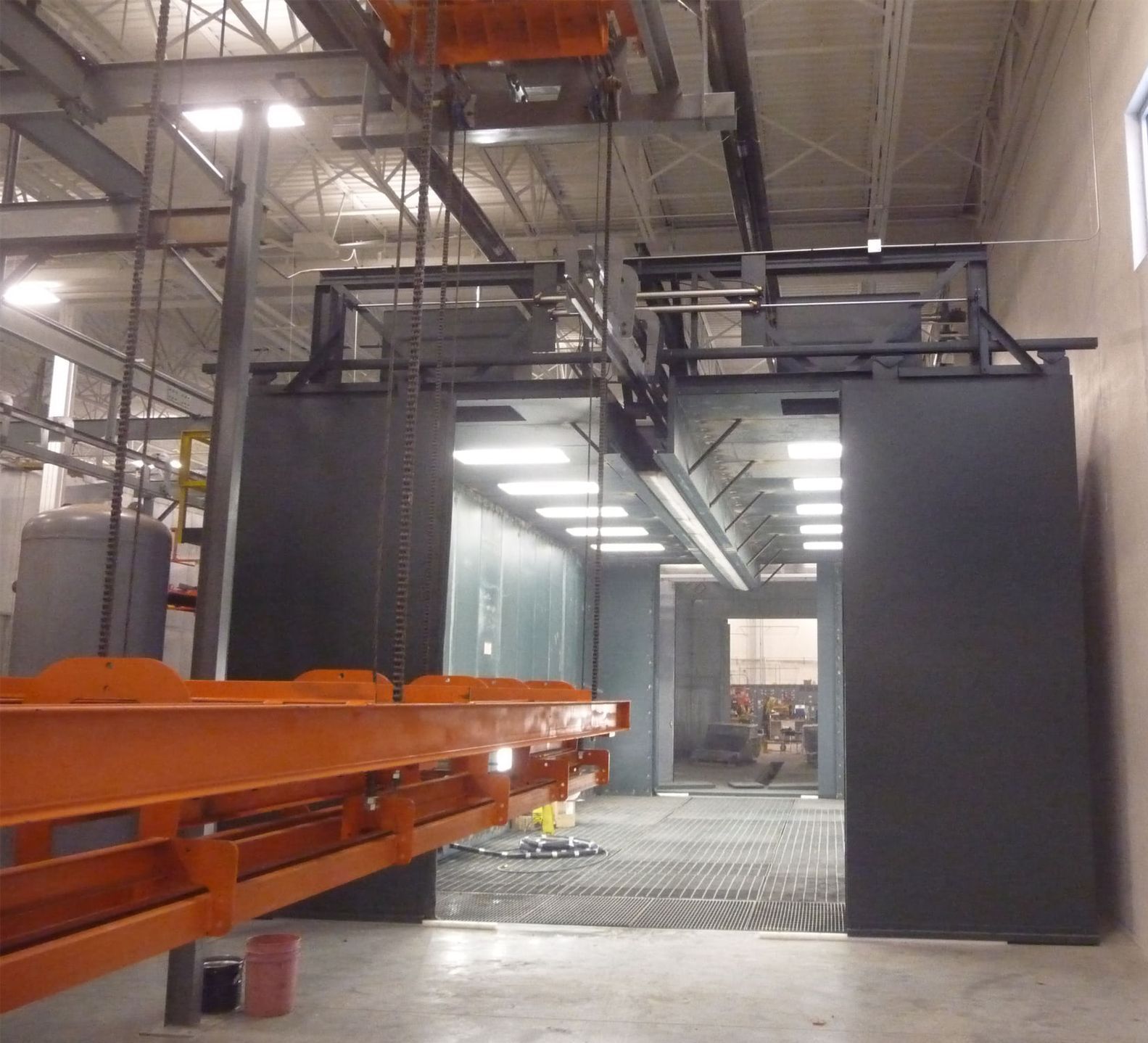 blast room booth with power free overhead conveyor 