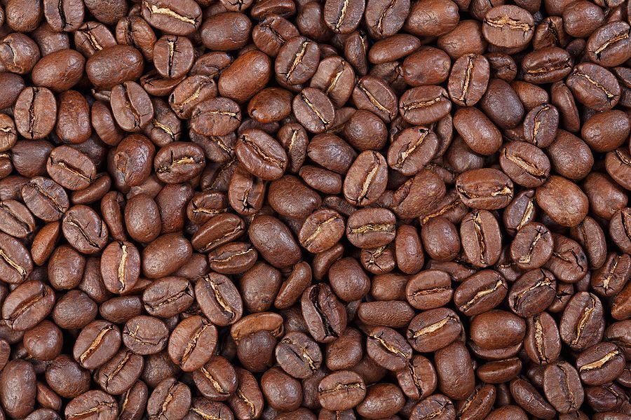 A close up of a pile of coffee beans