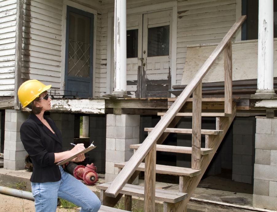A Woman Checking an Old House — As Is Where Is in Wellington, NZ