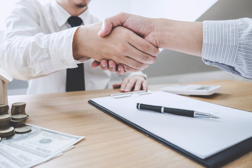 Shaking Hands After Successful Transaction — As Is Where Is in Hamilton, NZ