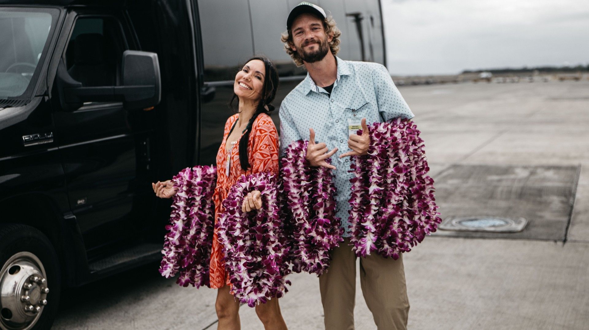 Holding Hawaiian lei necklace at the airport
