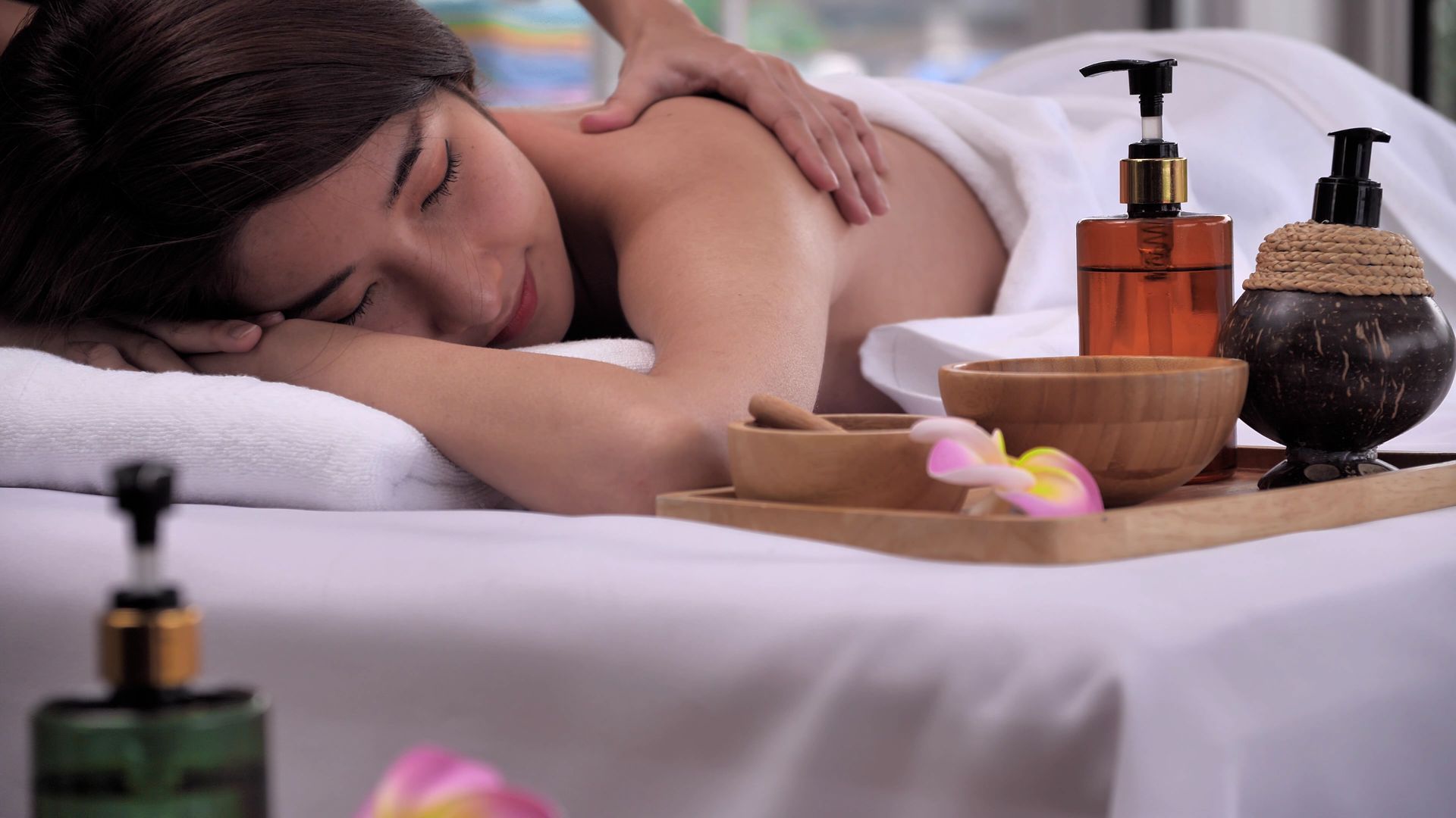 A woman is getting a massage at a spa.