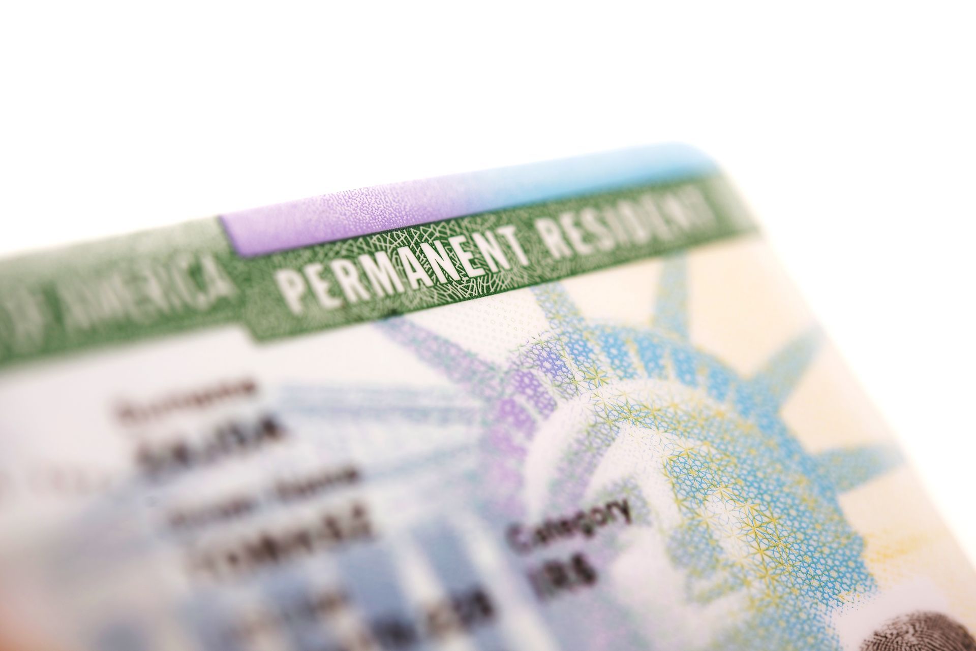 a close up of a green card for a permanent resident .