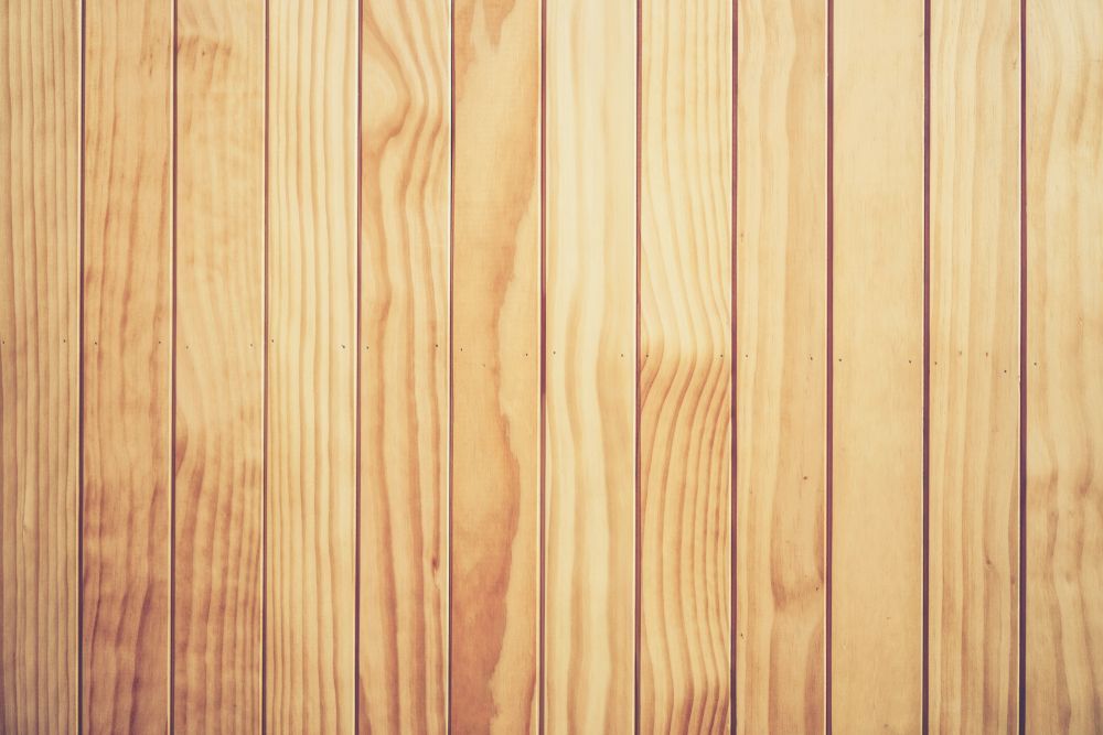 Vertical Wooden Planks With Varying Light Brown Tones — Dachboe Your Handyman In Townsville, QLD