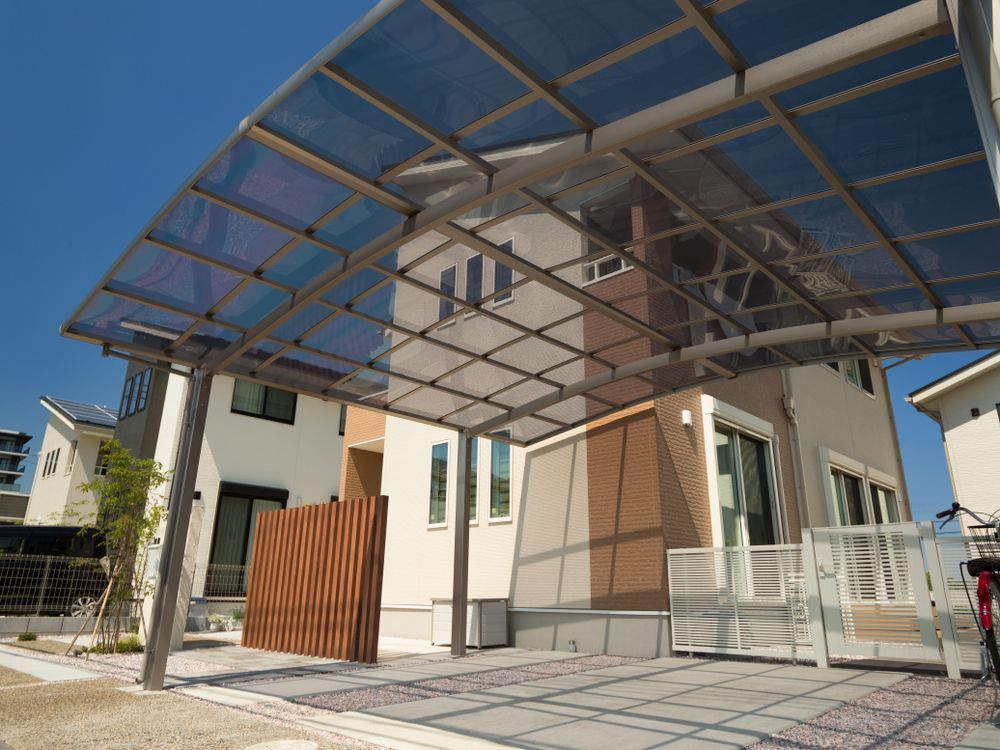 Carport Attached to a Two-story House With a Transparent Roof — Dachboe Your Handyman In Ingham, QLD