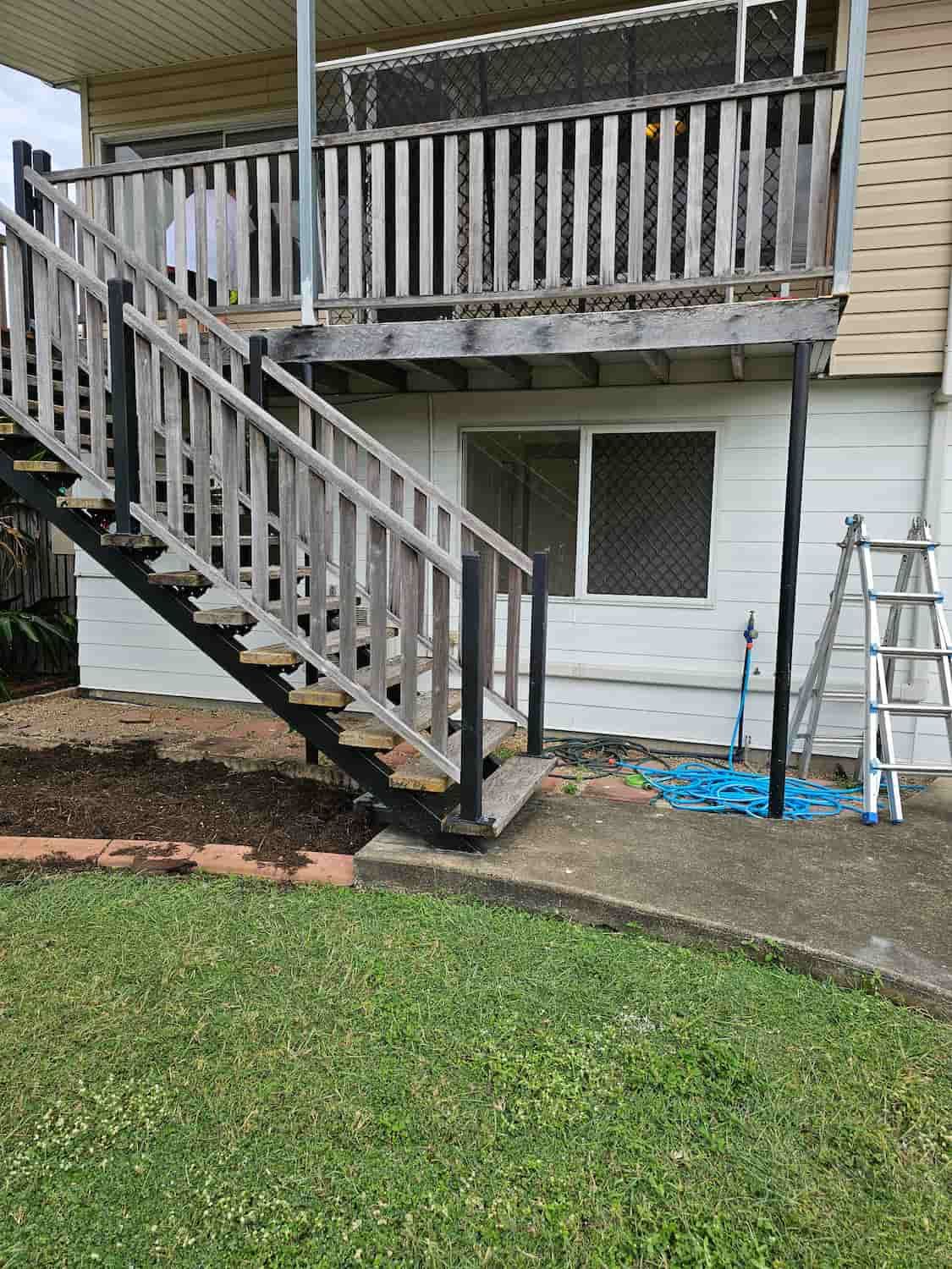 A House With A Deck And Stairs Leading Up To It — Dachboe Your Handyman in Ayr, QLD
