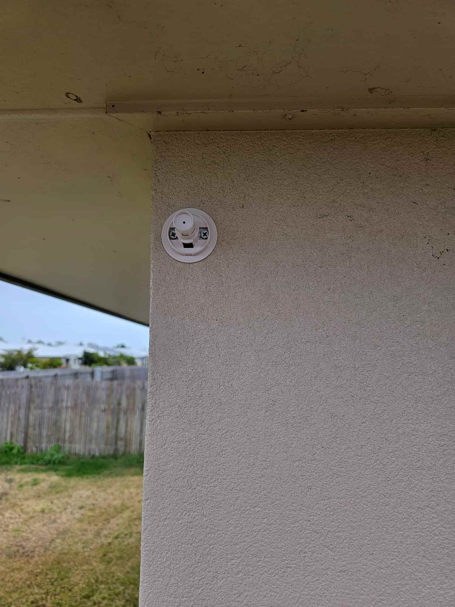 There Is A White Electrical Outlet On The Side Of A Building — Dachboe Your Handyman in Townsville, QLD