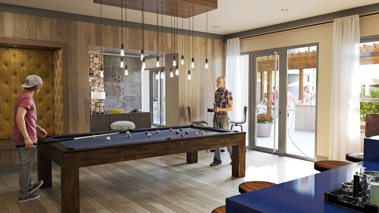 Two people playing pool in a modern community game room with wood paneling and glass doors.