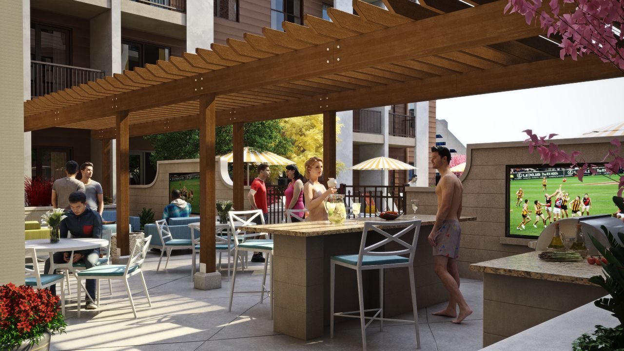 Outdoor communal lounge under a wooden pergola with bar seating and people socializing.