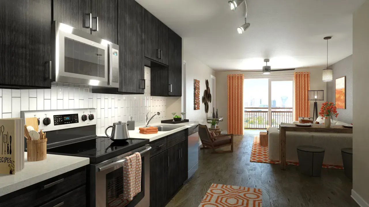 Open-concept kitchen and living area in an apartment with stainless appliances and balcony view.