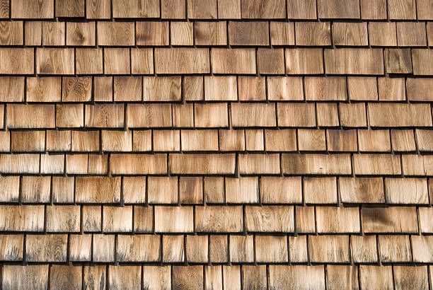 A close up of a wooden shingle roof
