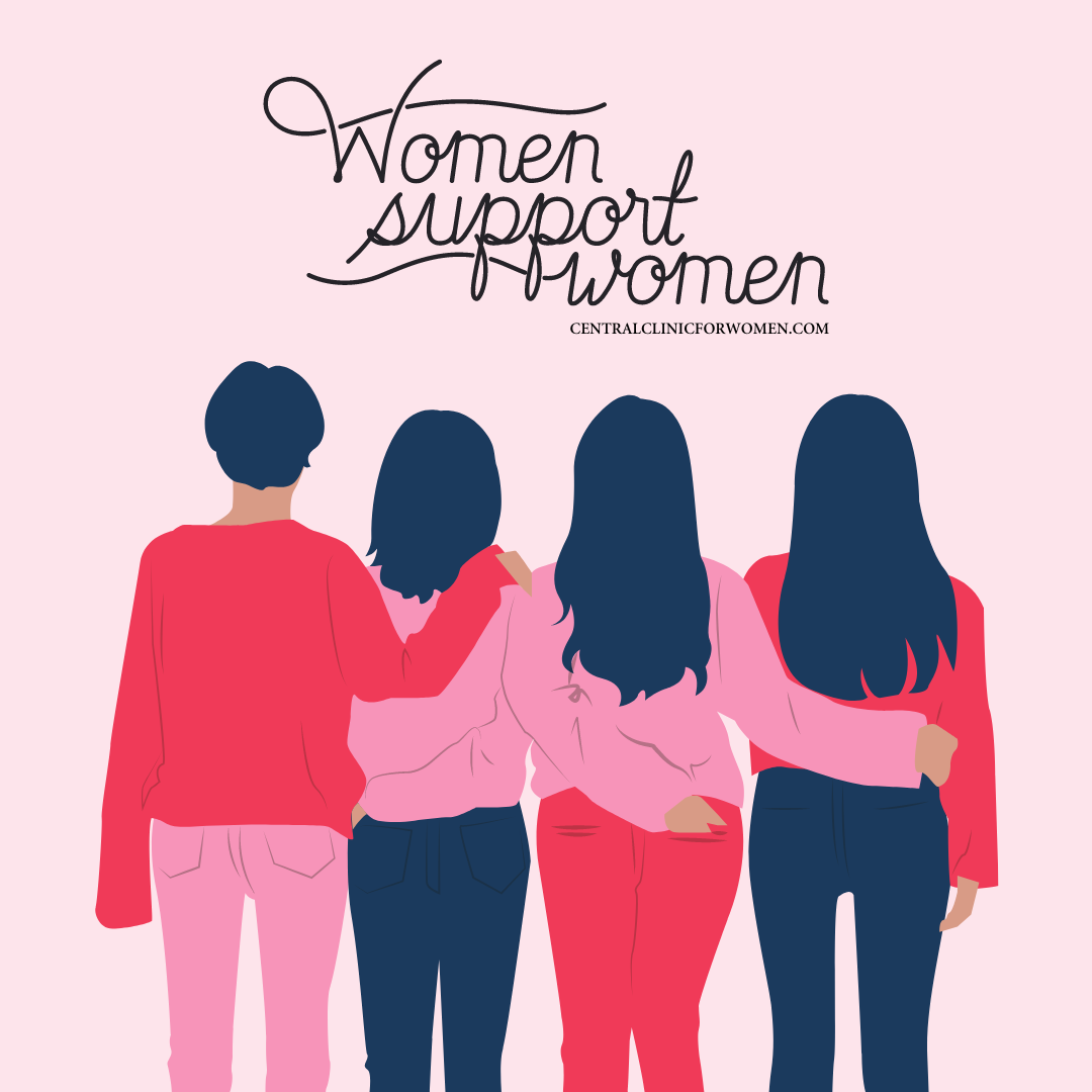 A group of women are standing next to each other with their arms around each other.