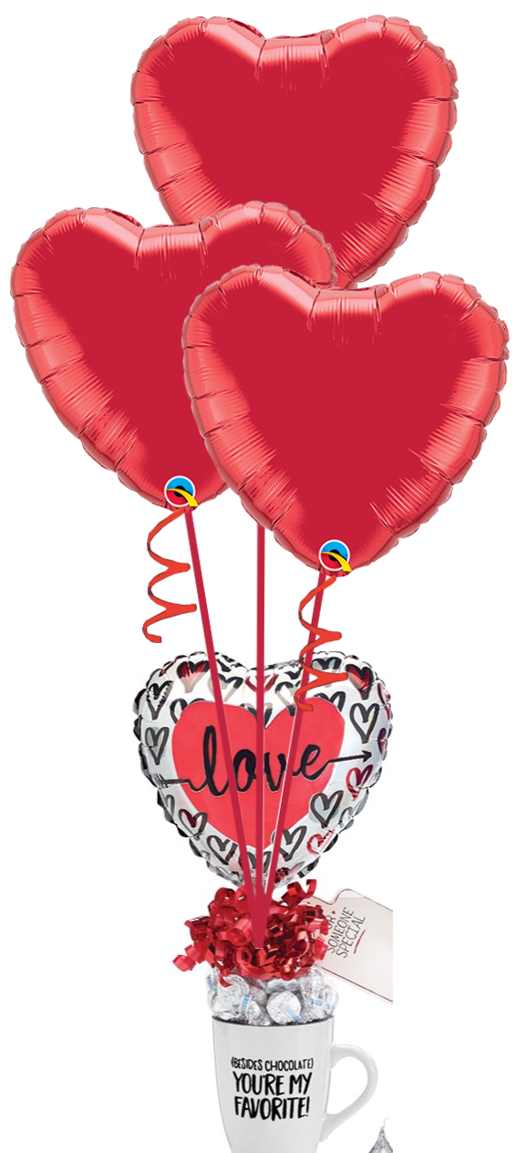 three heart shaped balloons are sitting on top of a coffee mug