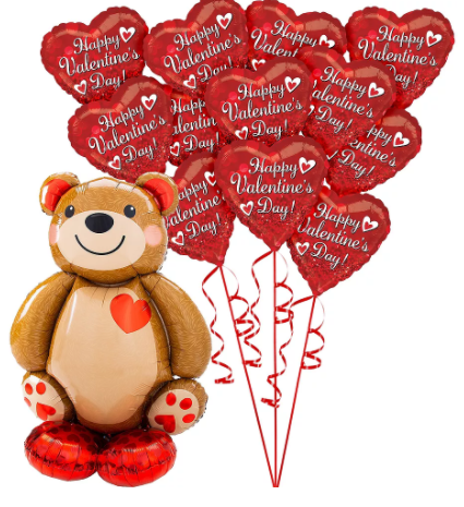 a teddy bear is sitting next to a bunch of valentine 's day balloons