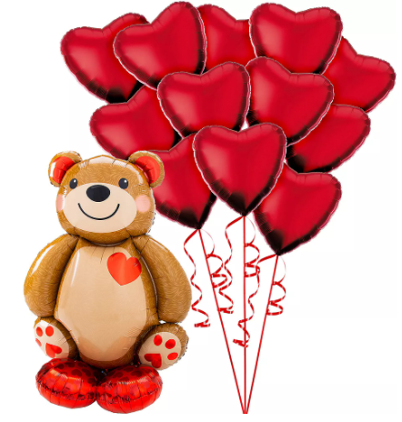 a teddy bear is standing next to a bunch of heart shaped balloons