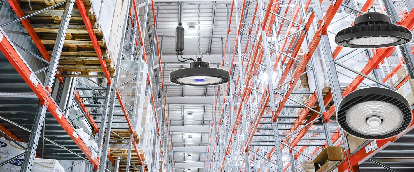 Warehouse interior with LED lights hanging from the ceiling, metal shelving, and packaged goods.