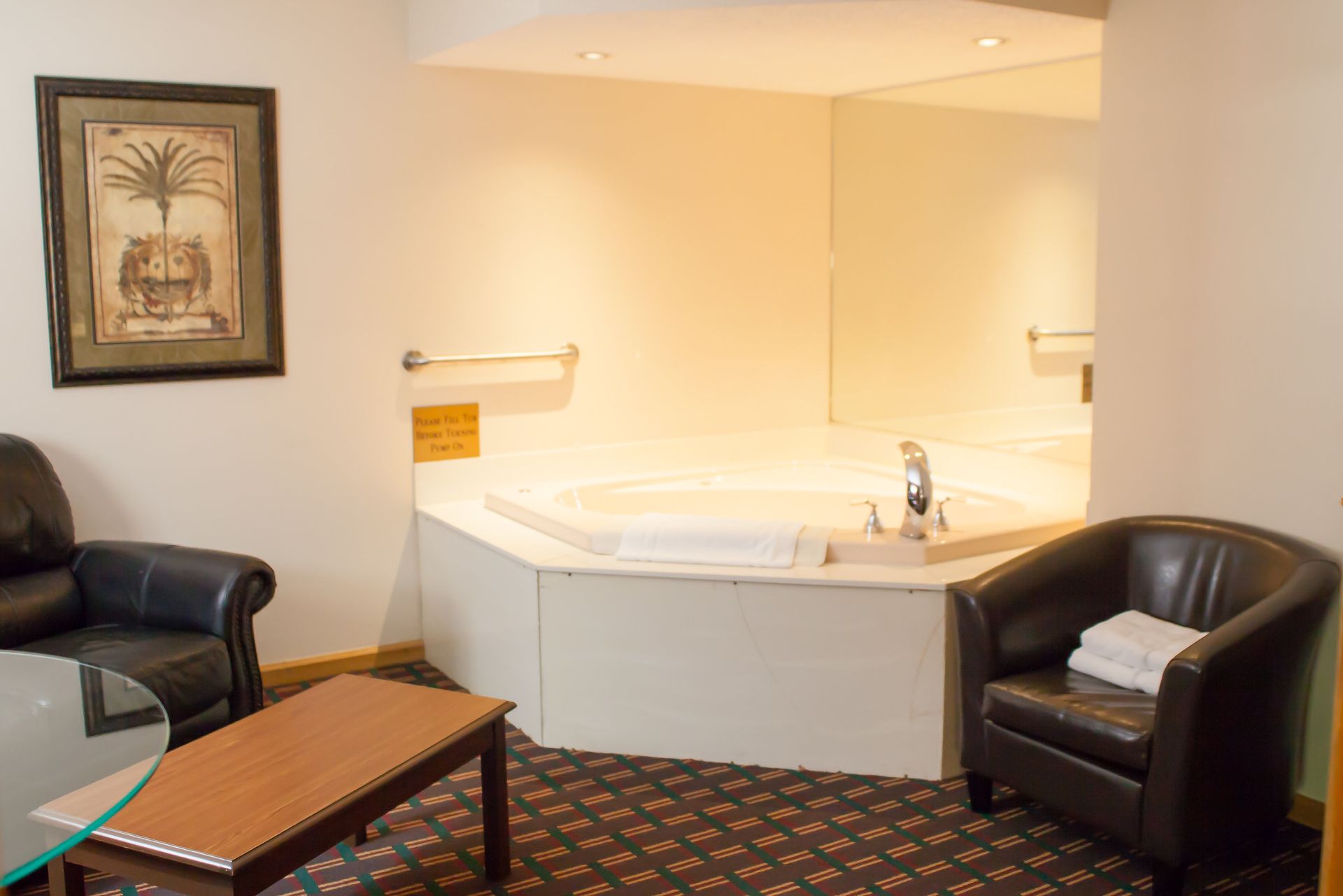 There is a jacuzzi tub in the middle of the room.