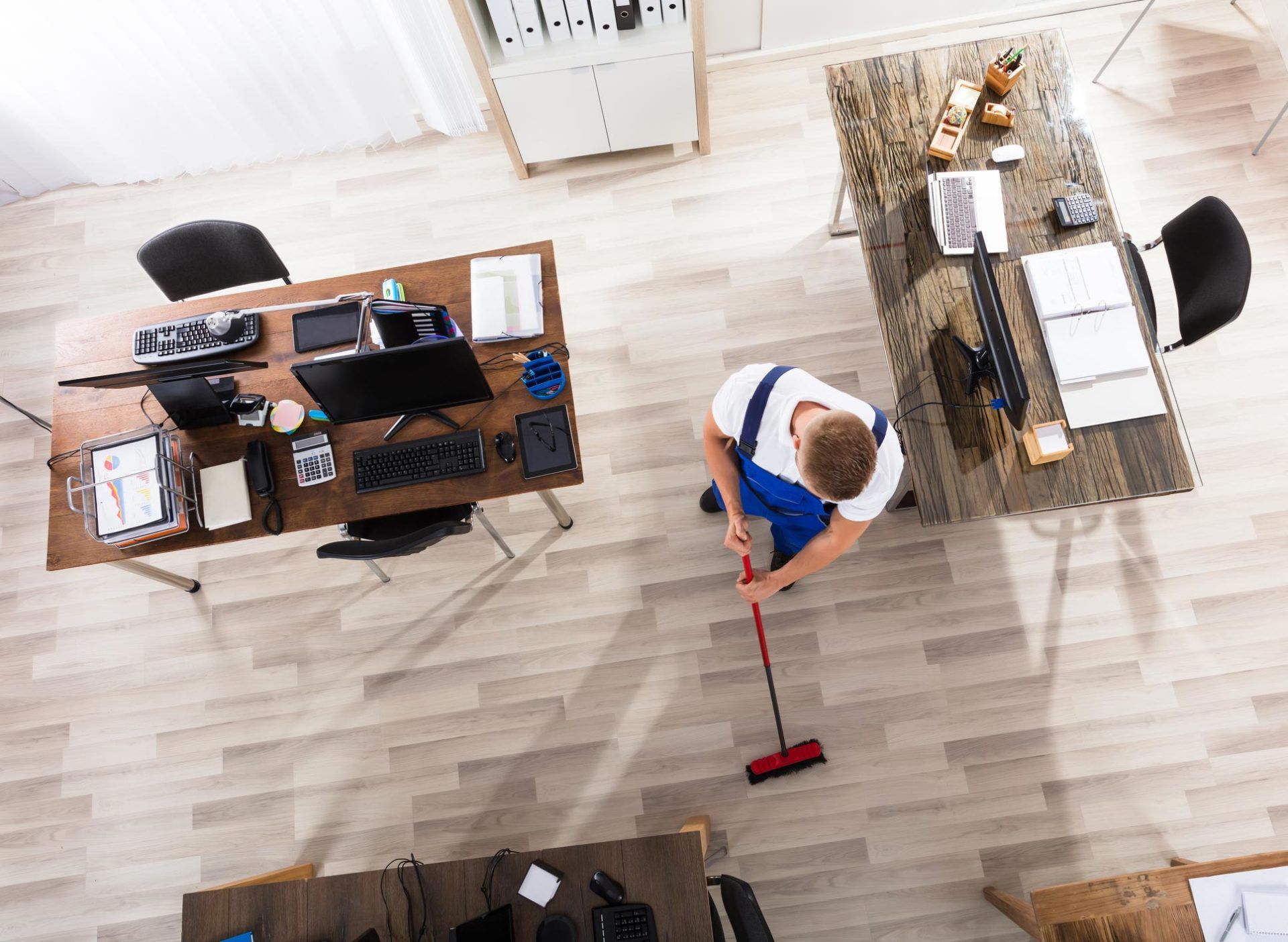 Experienced Cleaning Company — Man Cleaning the Office in Will County