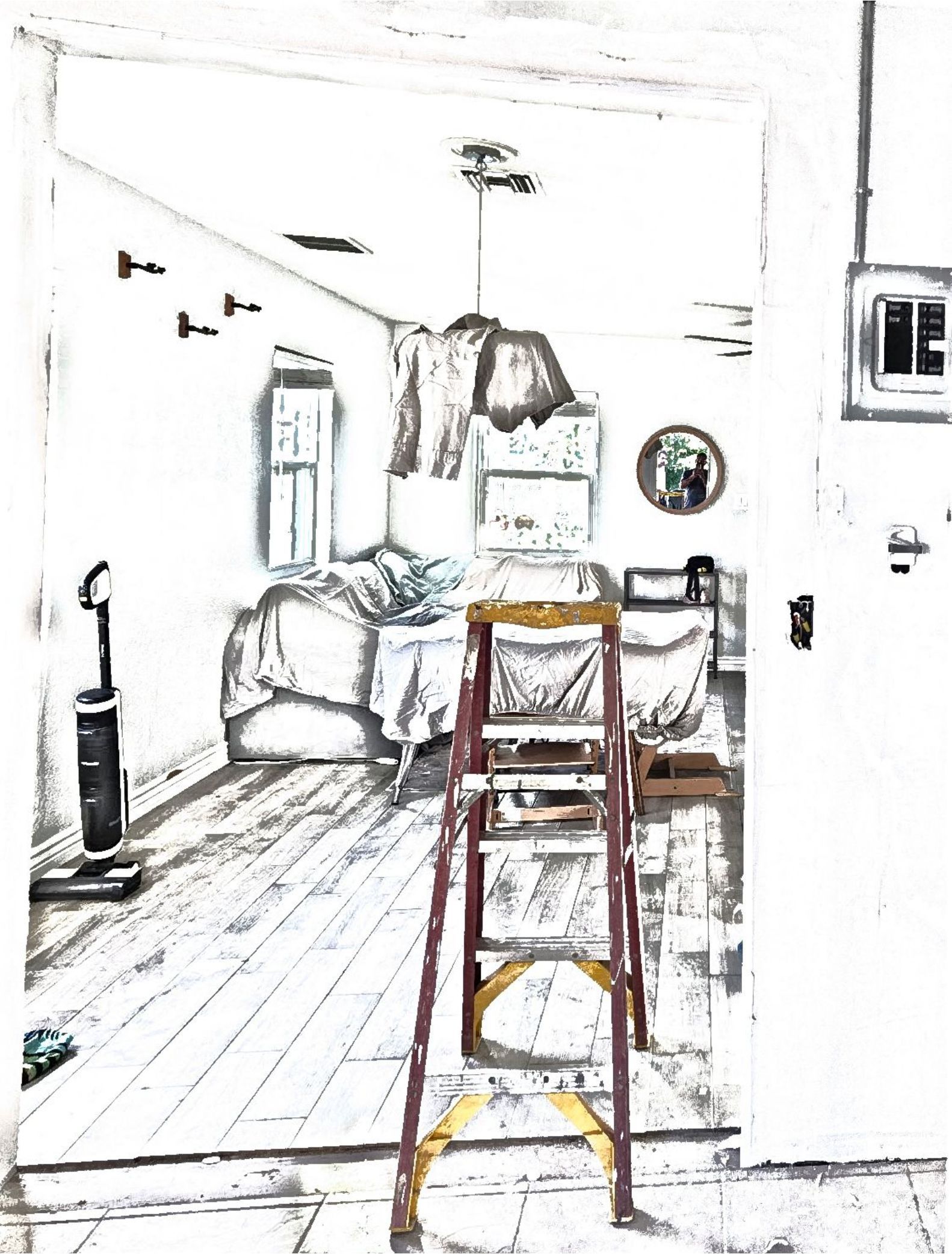 A room interior with an open doorway. A stepladder stands in front of a bed.