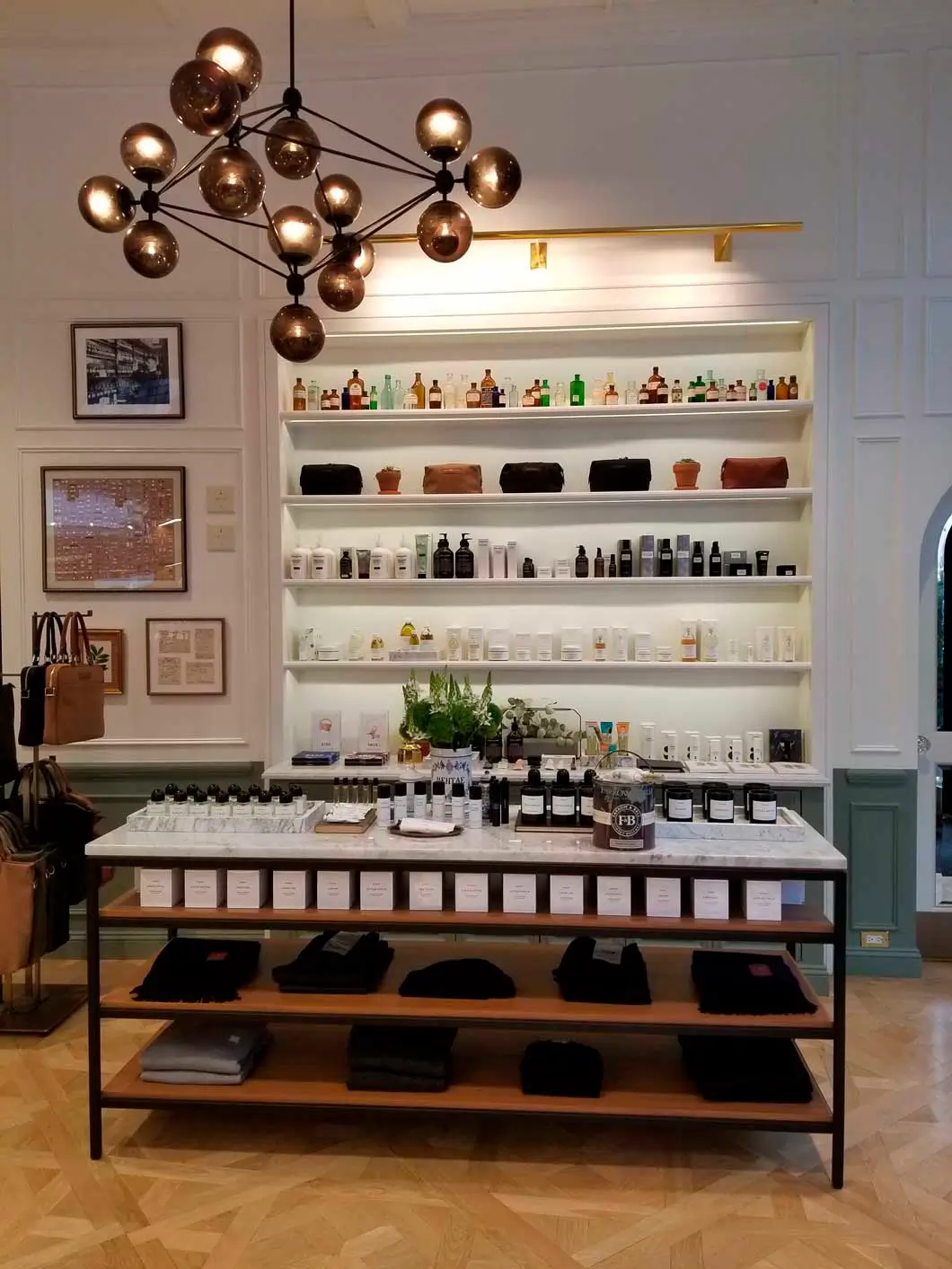 A store with a table and shelves filled with lots of items.