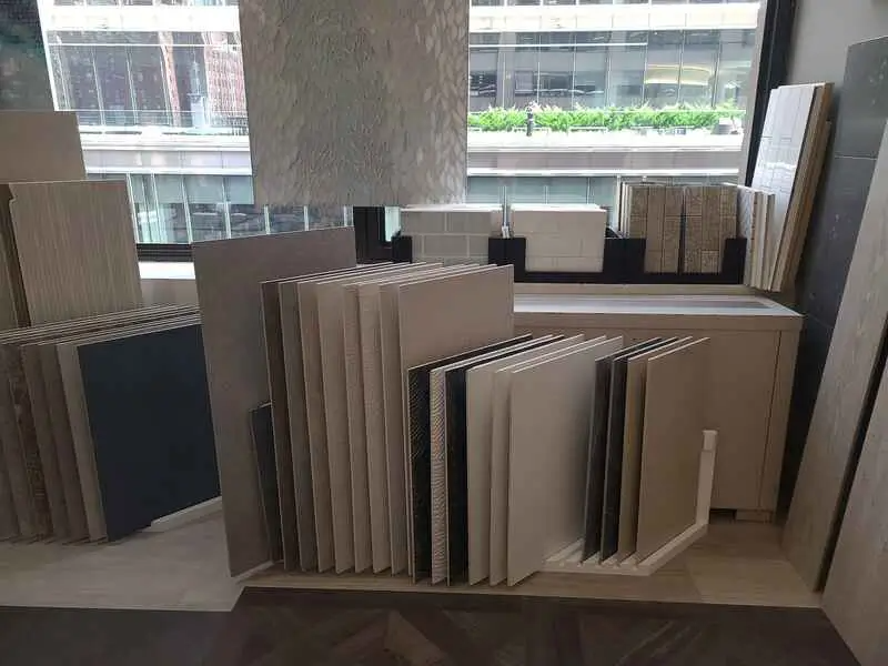 A display of tiles in a store with a window in the background.