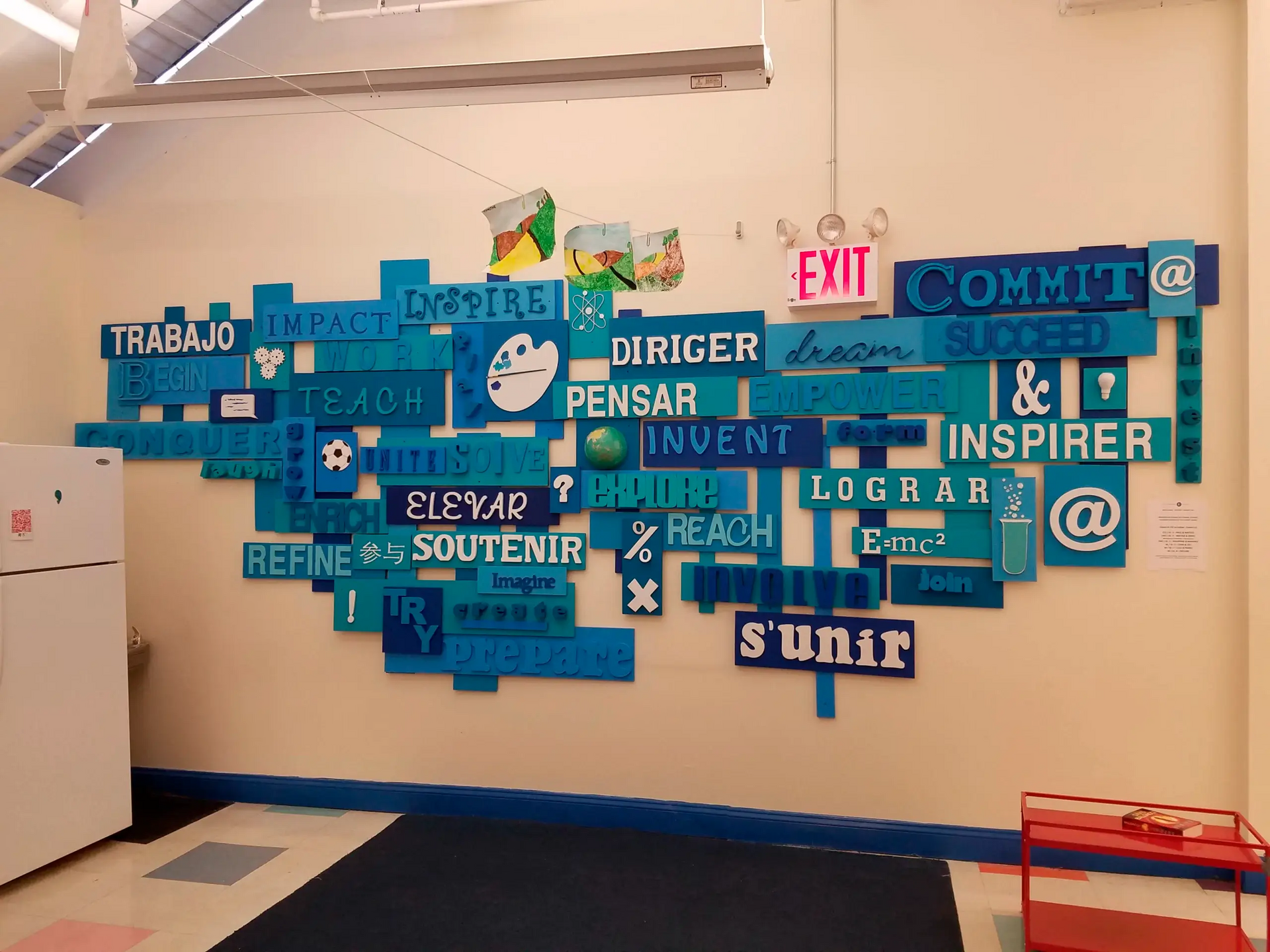 A wall with a lot of signs on it including one that says commit