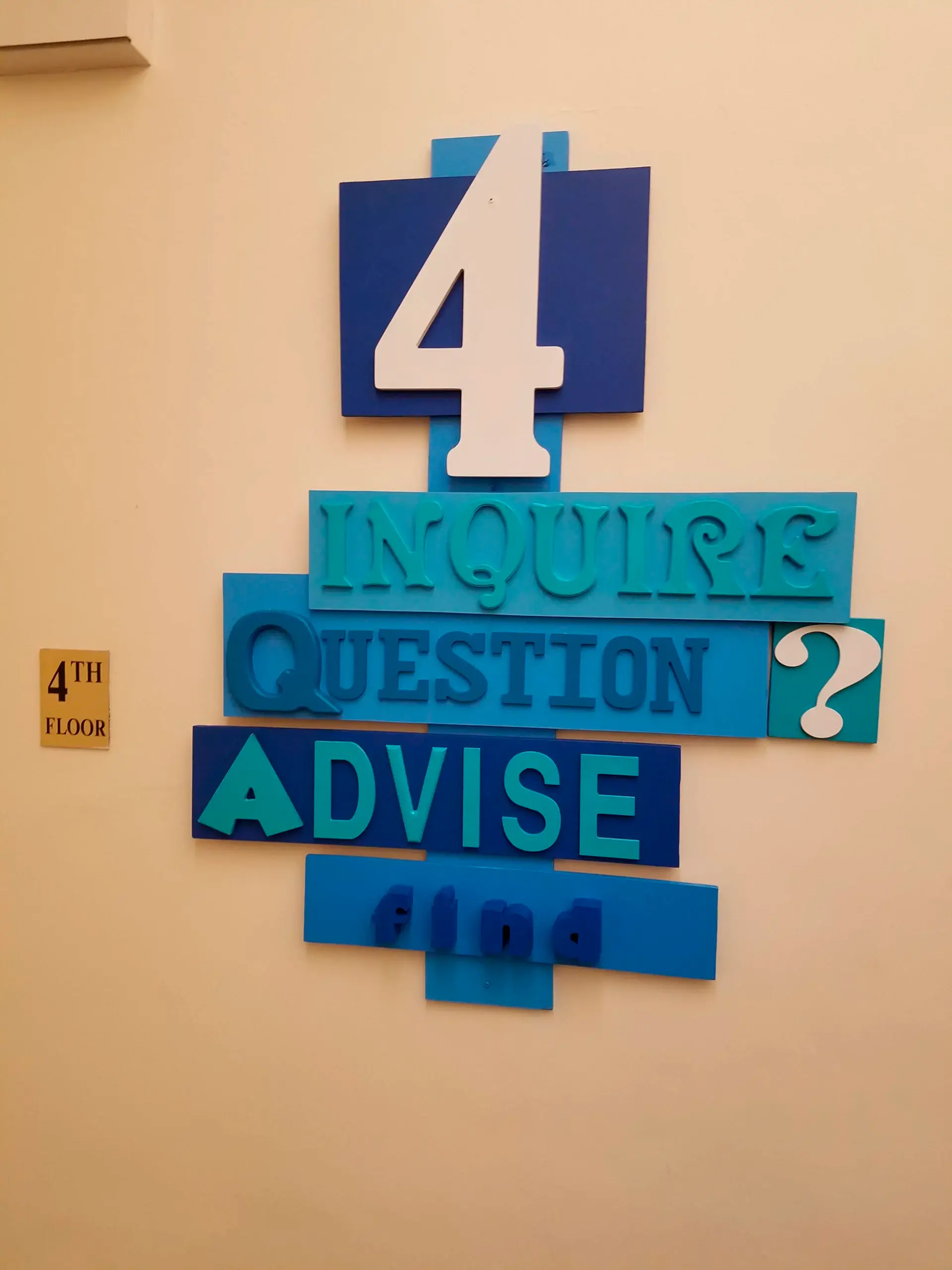 A sign on a wall that says 