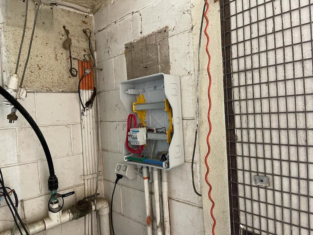 There Is a Box on The Wall with A Lot of Wires Coming out Of It — Davey Service & Maintenance Qld In Clinton, QLD