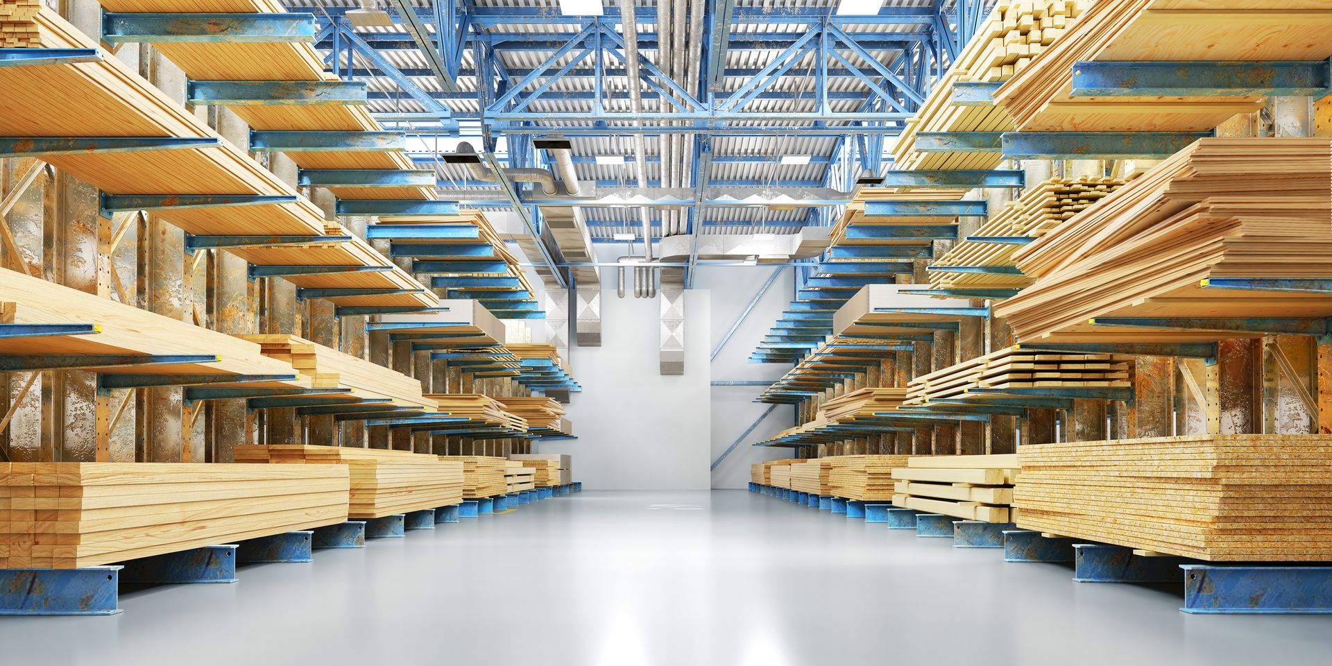 Wooden boards stored on shelves in a warehouse. Bright, clean interior with a central pathway.