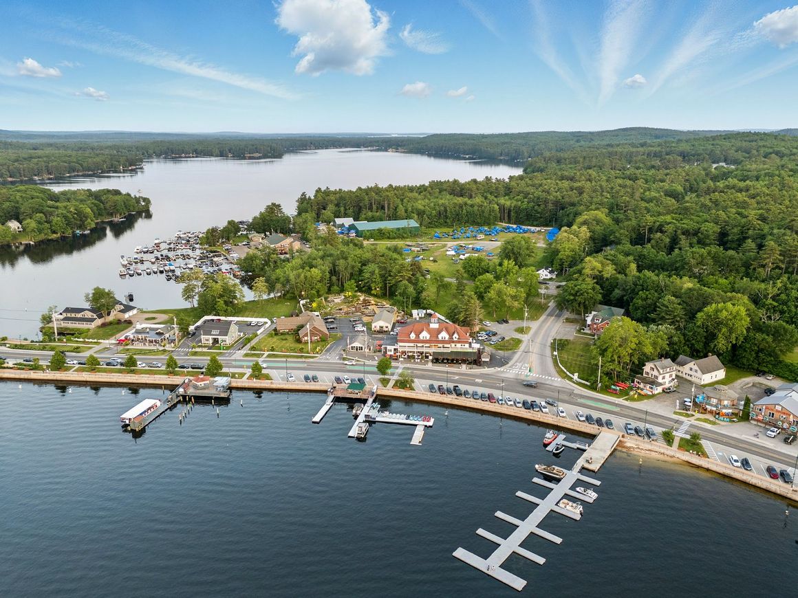A sunset over a mountain range with a lot of fog