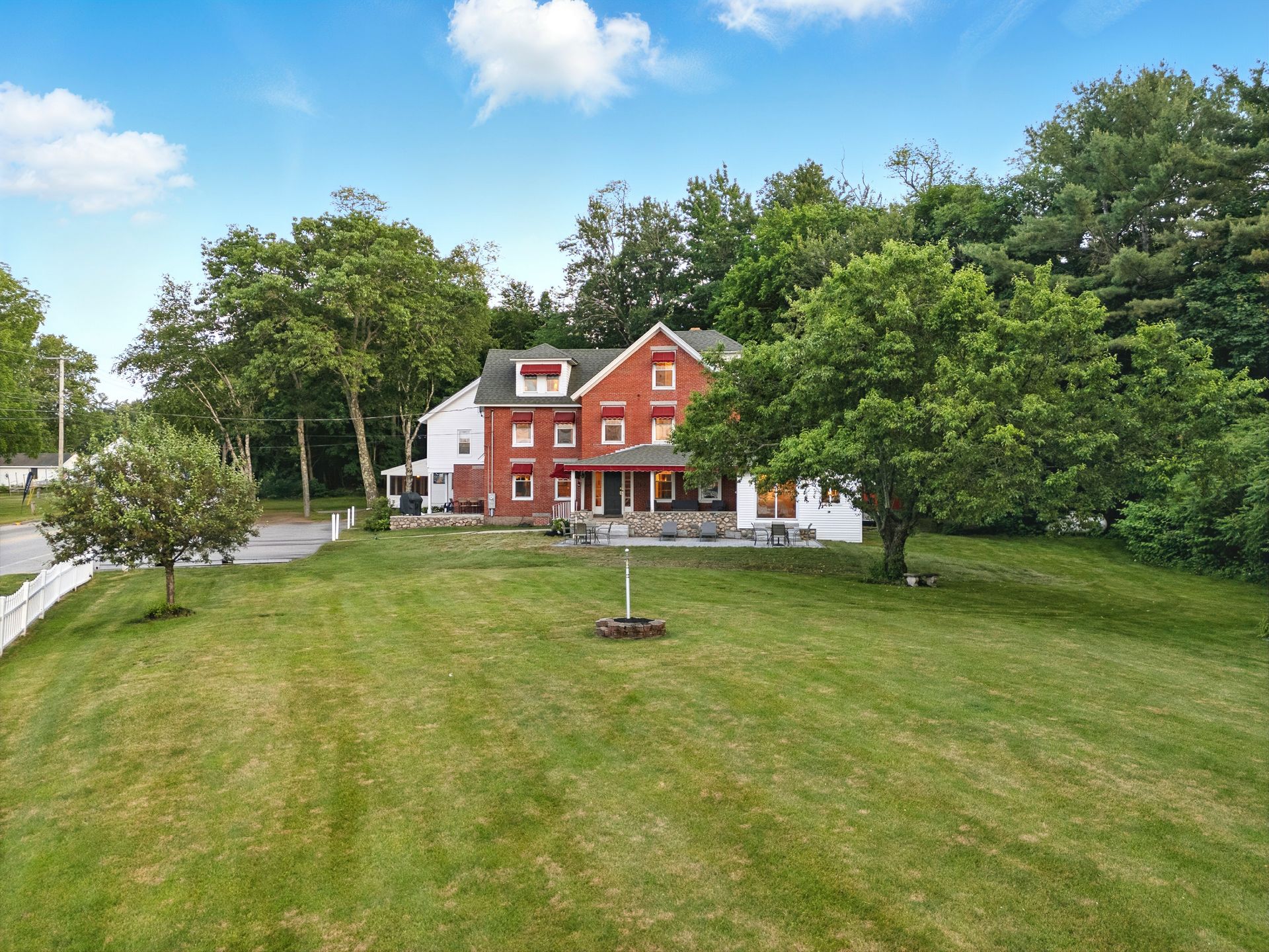 A sunset over a mountain range with a lot of fog