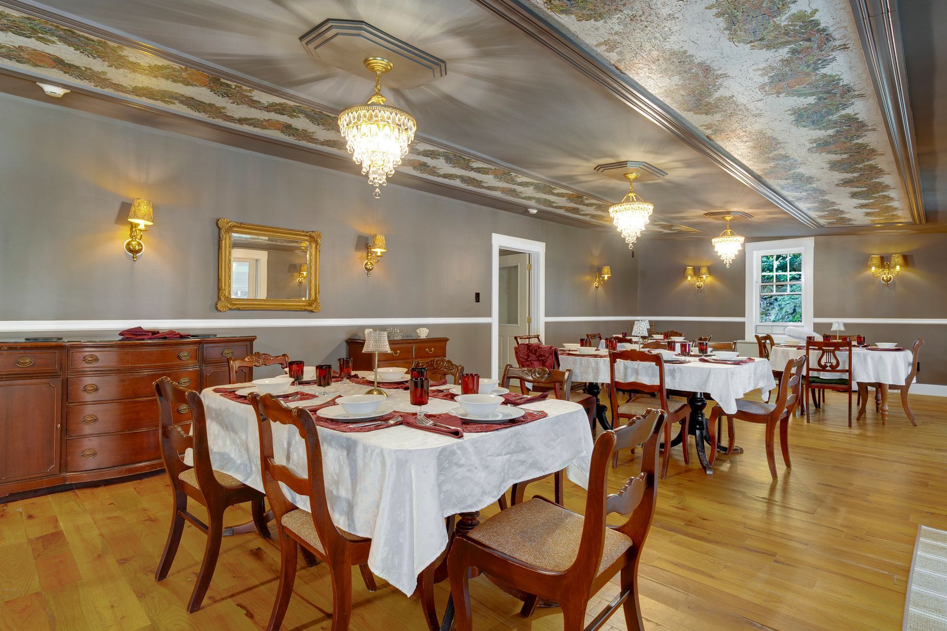 A sunset over a mountain range with a lot of fog