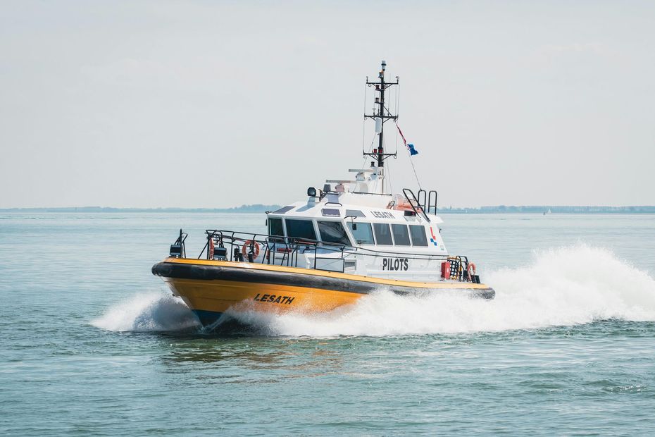 A sunset over a mountain range with a lot of fog