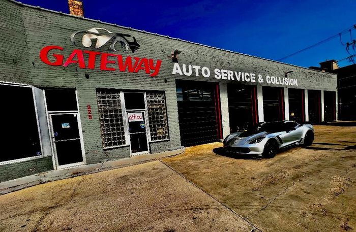 Gateway Auto Service & Collision storefront with a silver car parked outside on a sunny day