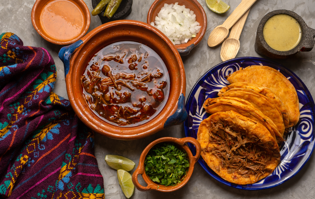 Wooden spice container with various colorful ground spices.