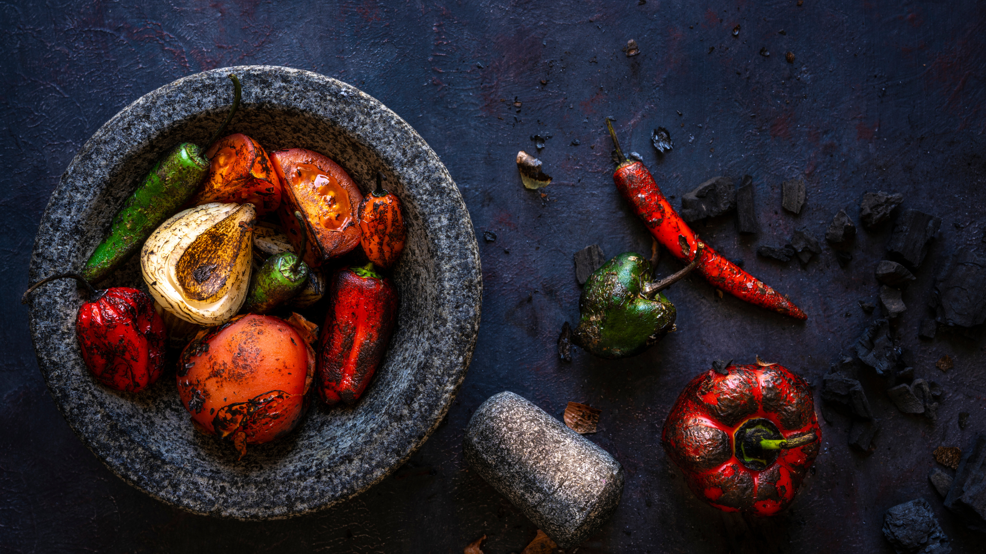 Dried citrus slices, lavender sprigs, and cinnamon sticks arranged on a woven surface.