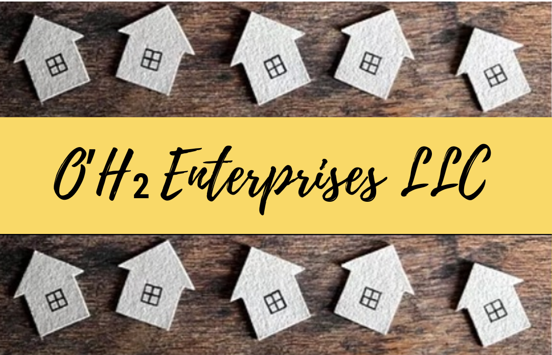 A bunch of small houses are sitting on top of a wooden table.