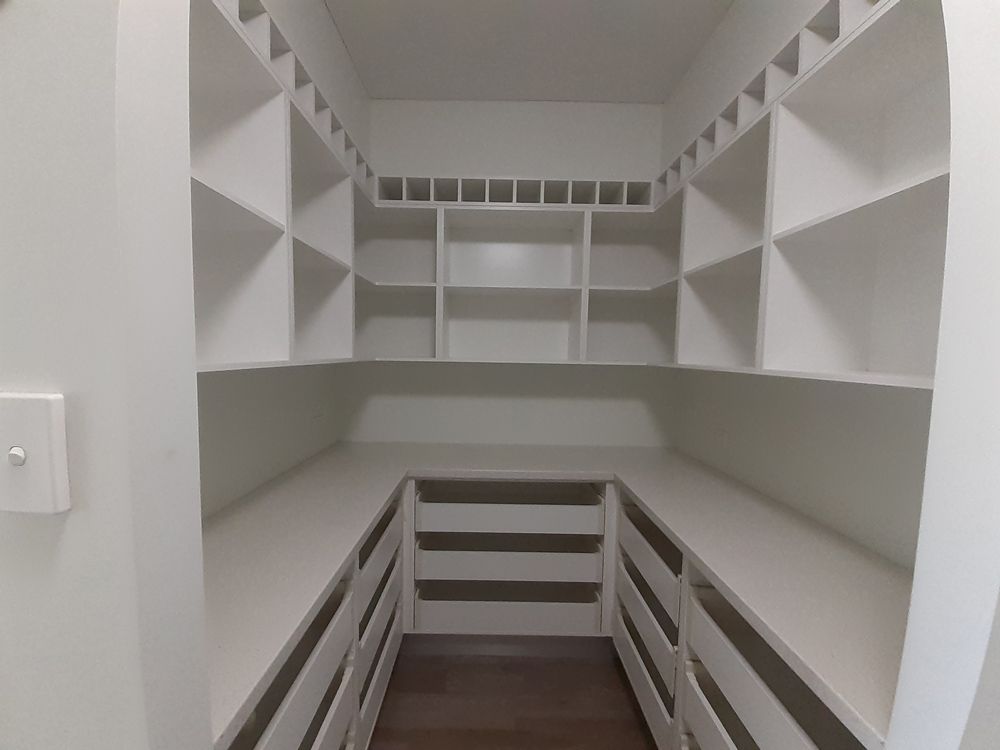 A Walk in Closet with Lots of Shelves and Drawers — Cairns Vacate Clean in Manunda, QLD