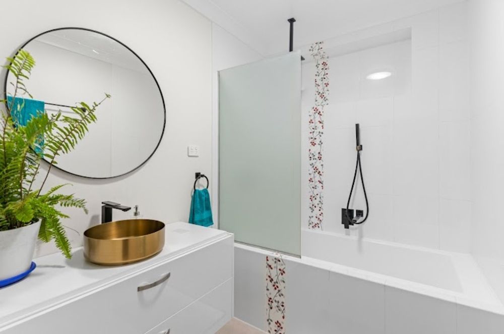 A Bathroom with A Sink , Mirror , Tub and Shower — Cairns Vacate Clean in Manunda, QLD